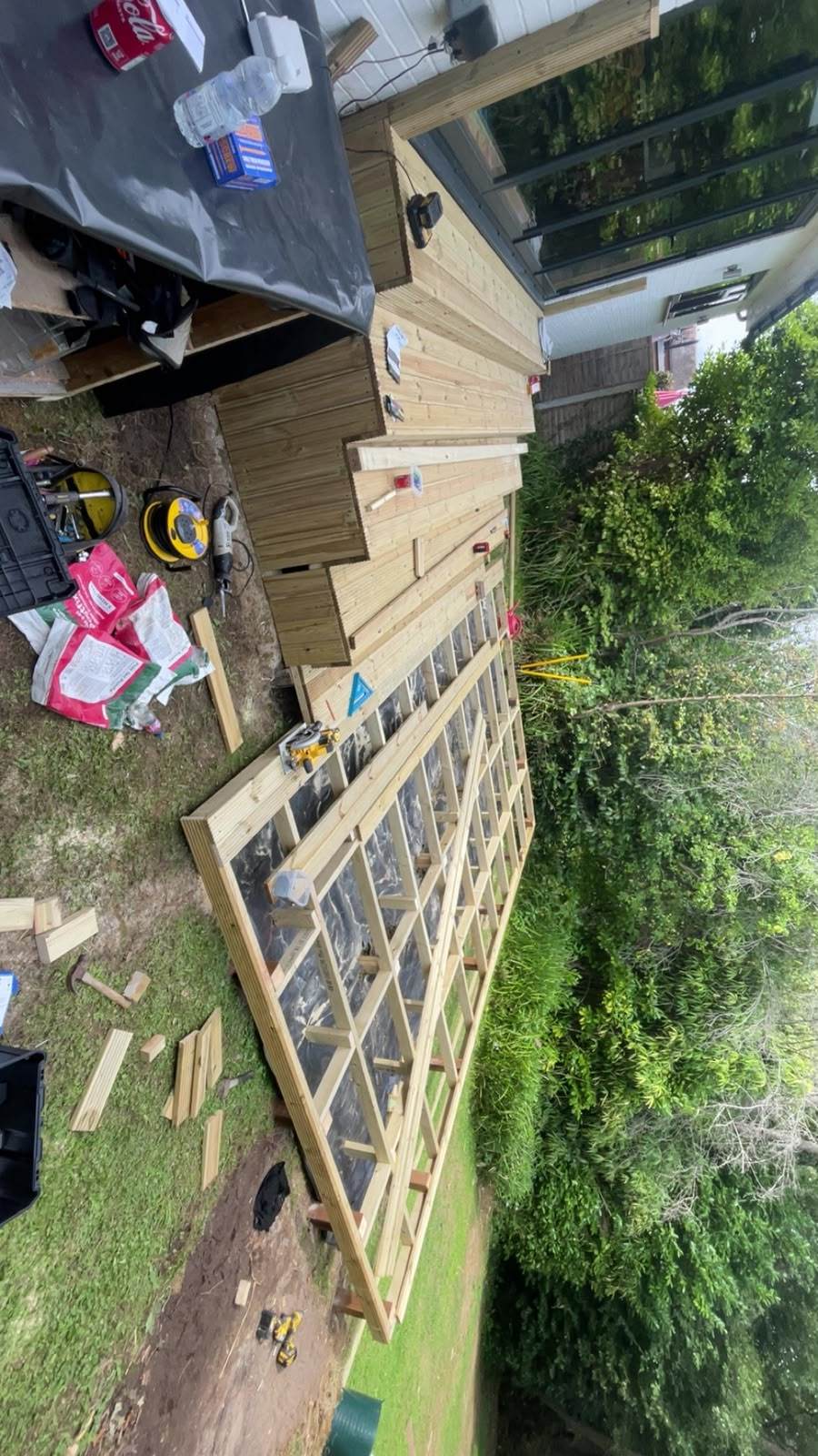 Timber decking boards and stepped access under construction